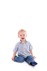 sad child sitting on floor crying over white background