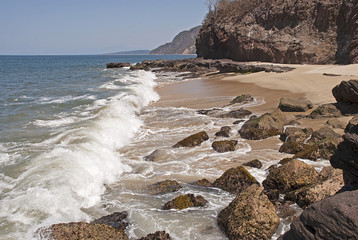 Surf, boulders and beach