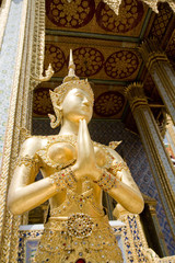 Fototapeta na wymiar Statue of a legend Kinnaree in Wat Phra Kaeo, Bangkok, Thailand