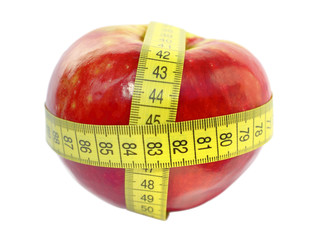 red apple and measuring tape isolated on white background
