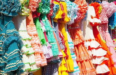 colorful gipsy dresses in rack hanged in Spain - obrazy, fototapety, plakaty