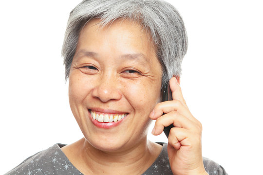 happy mature woman over cell phone