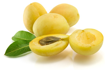 apricots with green leaf isolated on white background