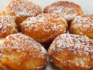 A Plate of Freshly Made Aebelskivers with Powdered Sugar