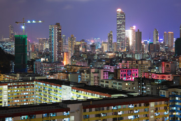 Naklejka premium Hong Kong with crowded buildings at night