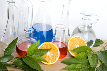 Laboratory flask and orange