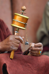 Prayer wheel in hand