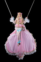 Pretty girl in fary-tale doll costume fly