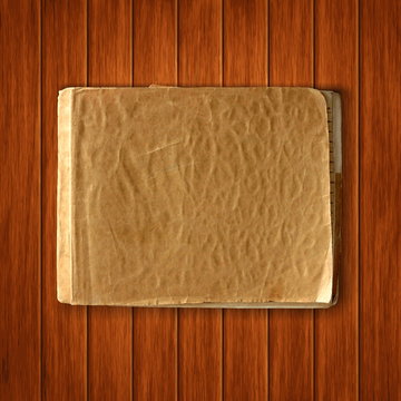 Vector old blank notebook on wood background