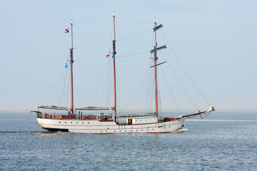 Typical old Dutch three mast clipper  sailing on the sea