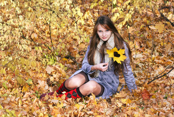 Beautiful girl with creative maple leaf