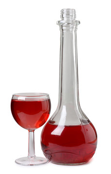 Red wine in bottle glass