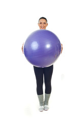Happy sport woman holding pilates ball