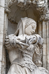 Beautiful statue of young woman in medieval dress