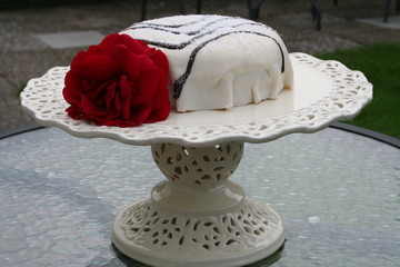 Marzipan gateau and red rose