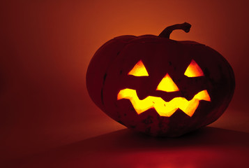 Glowing pumpkin with a candle inside