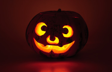 Glowing pumpkin with a candle inside