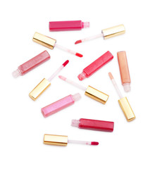 Set of lip glosses with different colours isolated on white