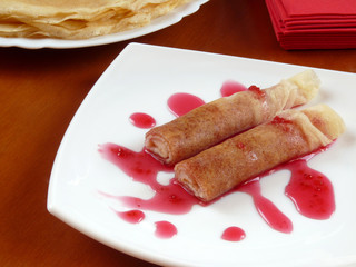 Delicious homemade pancakes with raspberry jam