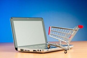 Internet online shopping concept with computer and cart