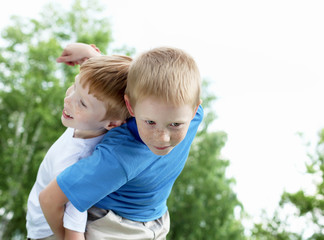 Portrait of two boys in the summer outdoors