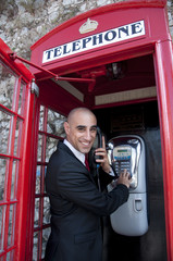 Business Man on the public phone
