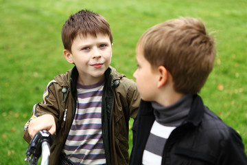 Boy on a bicycle in the green park