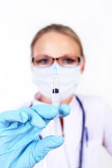 Young female doctor with syringe