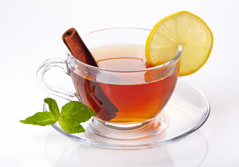 Cup of tea with lemon, cinnamon and mint