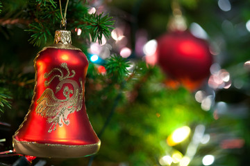 Christmas Ornament with Lighted Tree in Background, Copy Space