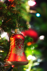Christmas Ornament with Lighted Tree in Background, Copy Space