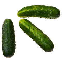 Three fresh ripe cucumbers isolated over white background.