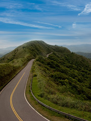 Green road with blue sky best for car adv use