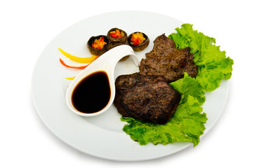 Well done steak served in the plate