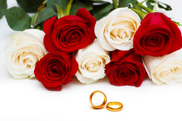 Wedding concept with roses and rings
