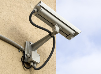 Video observation camera mounted on a wall