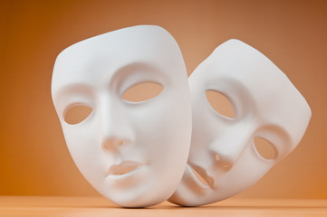 Theatre concept with masks against background