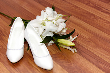 Wedding flowers and shoes on a floor