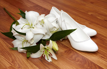 Wedding flowers and shoes on a floor