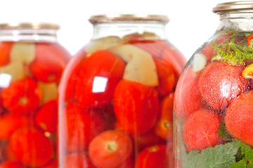 Fototapeta na wymiar red tomatoes in a glass jar