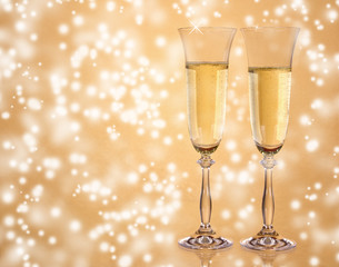Champagne glasses on sparkle blur background