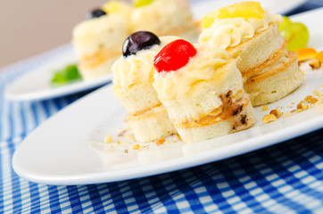 Plate full of tasty mini cakes