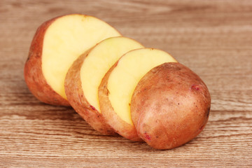 Potatoes on wooden background
