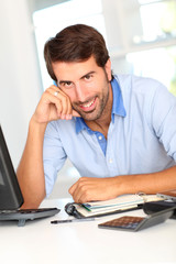 Fototapeta premium Portrait of happy office worker