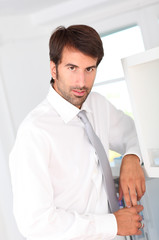 Fototapeta premium Portrait of businessman standing in office