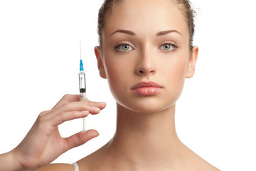Beautiful woman with syringe in her hand