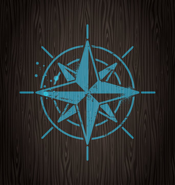 Vector compass rose painting on a wooden wall