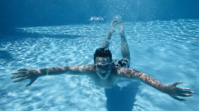 Holiday. The teenager in pool