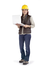 Female construction working holding a laptop