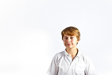 portrait of cute boy with white shirt in studio